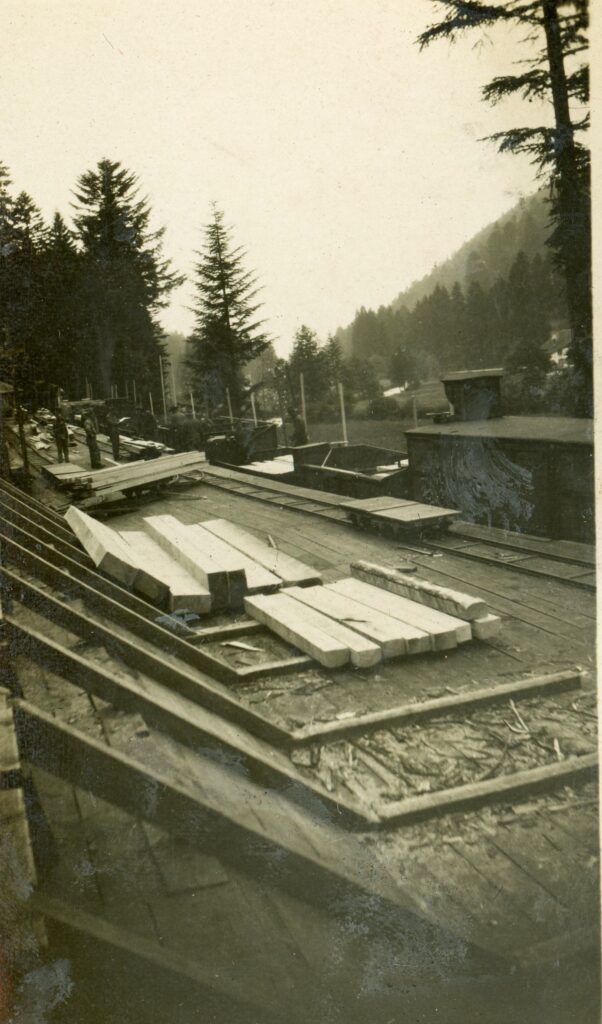 Stacks of railroad ties near a railroad