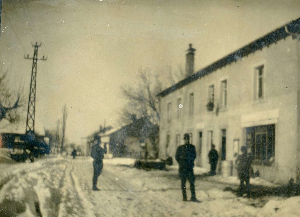 a snowy street in a village in France